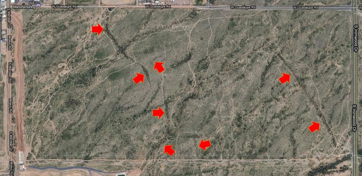 The red arrows indicate the locations of earth fissures. This area is located in central Arizona on the eastern outskirts of Phoenix