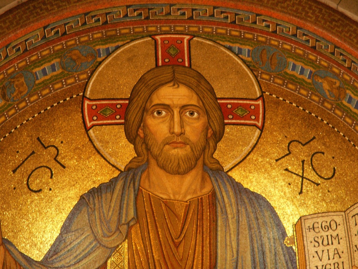 Why is Christ often depicted with a golden orb behind his head?