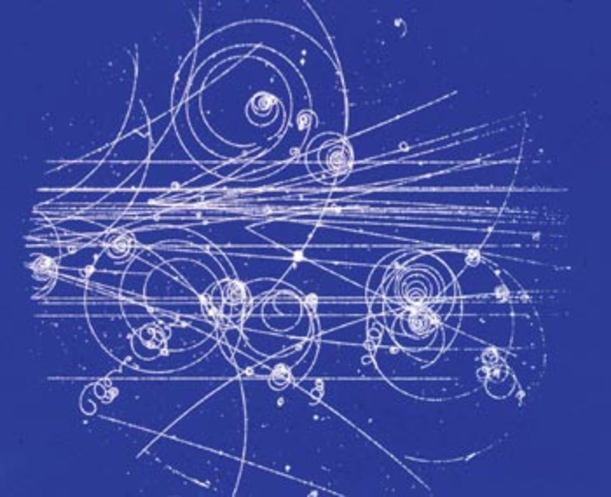 An example of tracks left by particles in a bubble chamber. The first antiparticle discovered, the positron, was discovered by observing similar tracks. The positron track was identical to an electron's but spiralling in the opposite direction.
