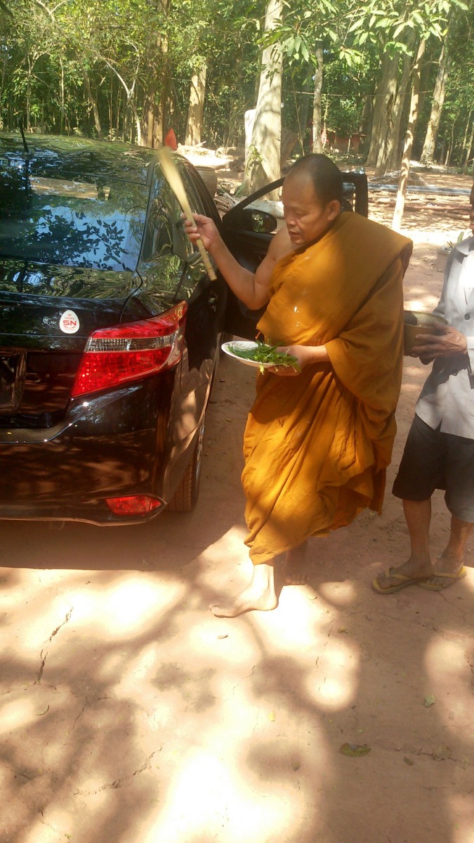 My wife's relative blessing our new Toyota Vios in January 2015