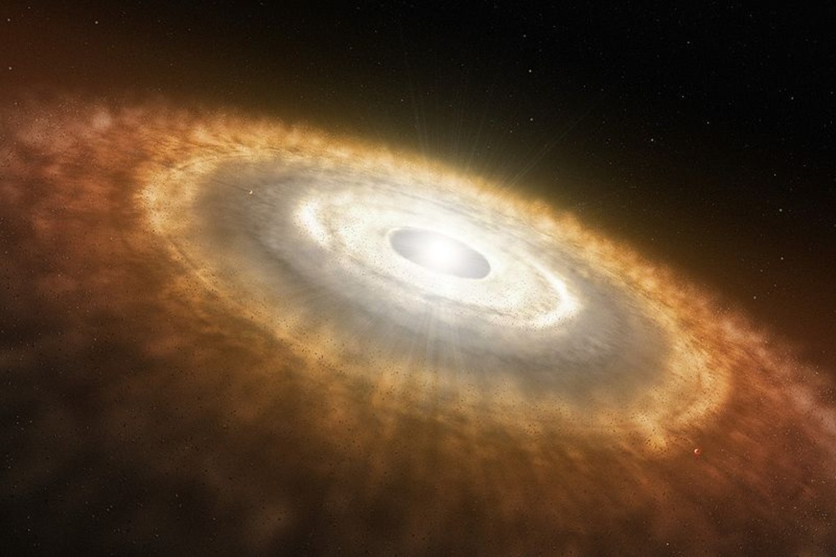 A new star still forming and surrounded by the proto-planetary discs of swirling gas that will later coalesce to form orbital planets. This is the same process that formed our own star, the Sun.