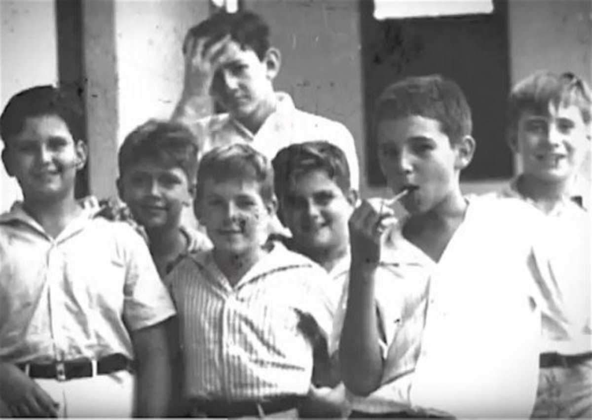 After being disruptive in elementary school, young Fidel was placed in a special Jesuit-run school for unruly youths.  Fidel is the one on the right with a sucker. 