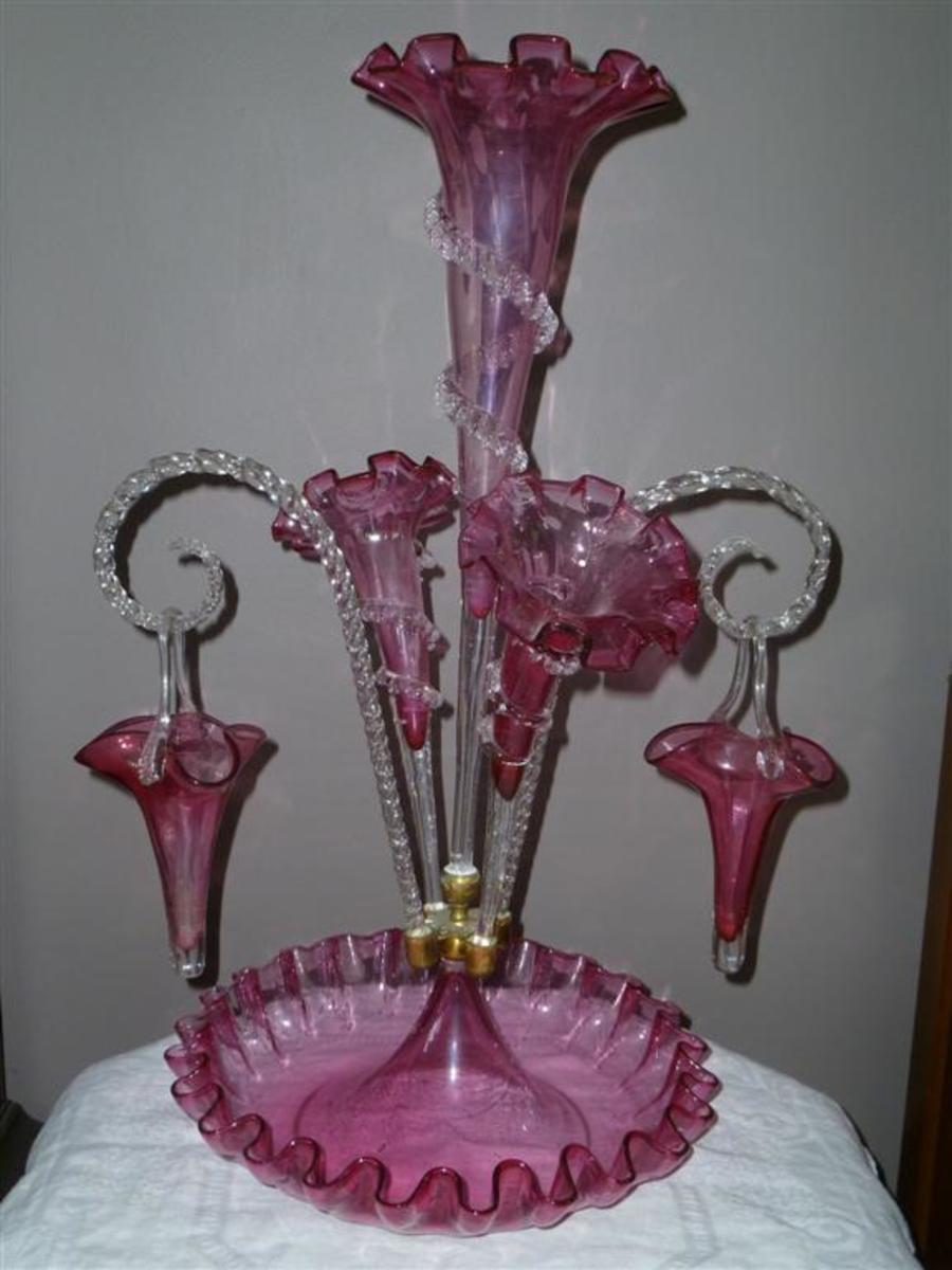 An epergne with hanging baskets.