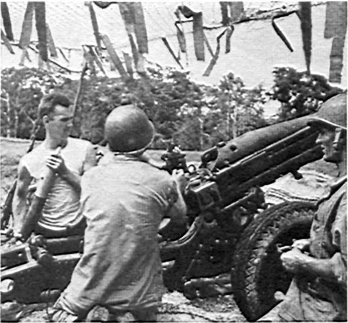US Marine artillery crew on Guadalcanal operating a 75mm pack howizter.  The jungle environment created unique problems for observers because of the tree canopy.  The climate was also corrosive to ammunition.