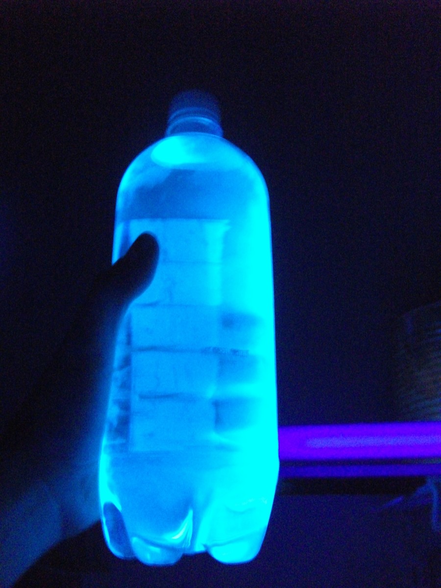 Tonic water glowing under a black light