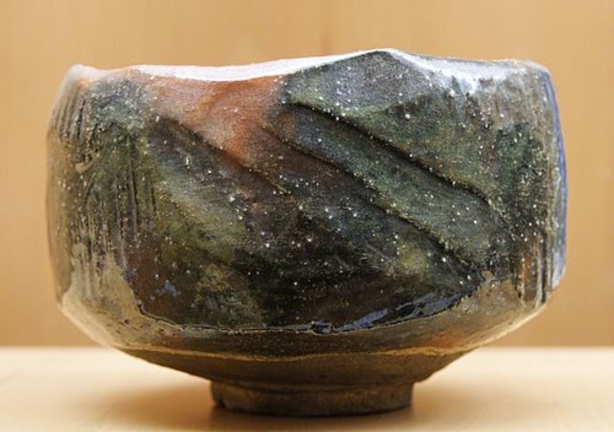 A red and black Raku chawan made by (and featuring the mark of) Ryonyu XI, potter of the 9th generation of Ryonyu potters. This piece is on display at the Musee des Beaux Arts de Lyon in Lyon, France.