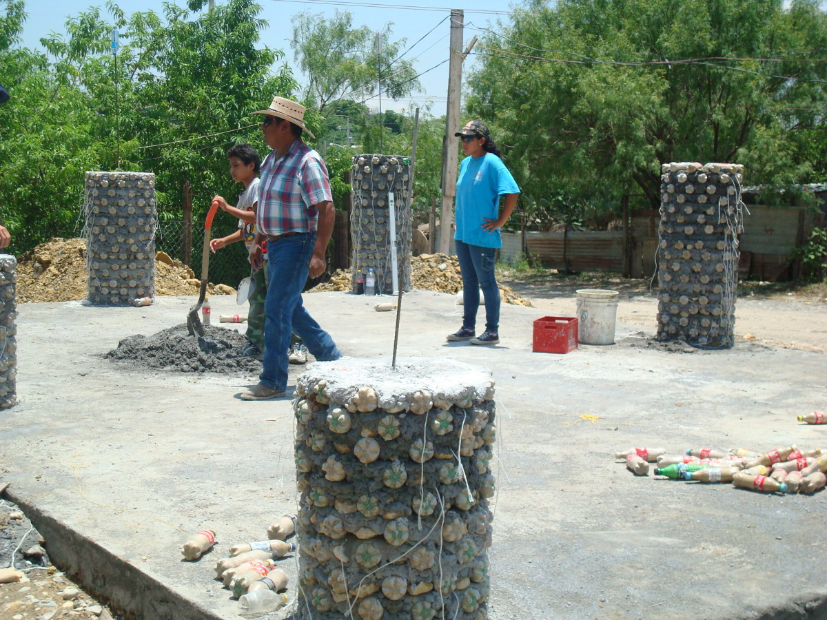 Build the support columns with plastic bottles