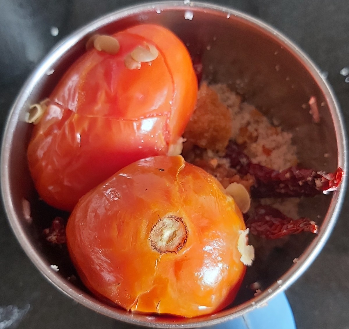 Transfer these tomatoes to the mixer jar.