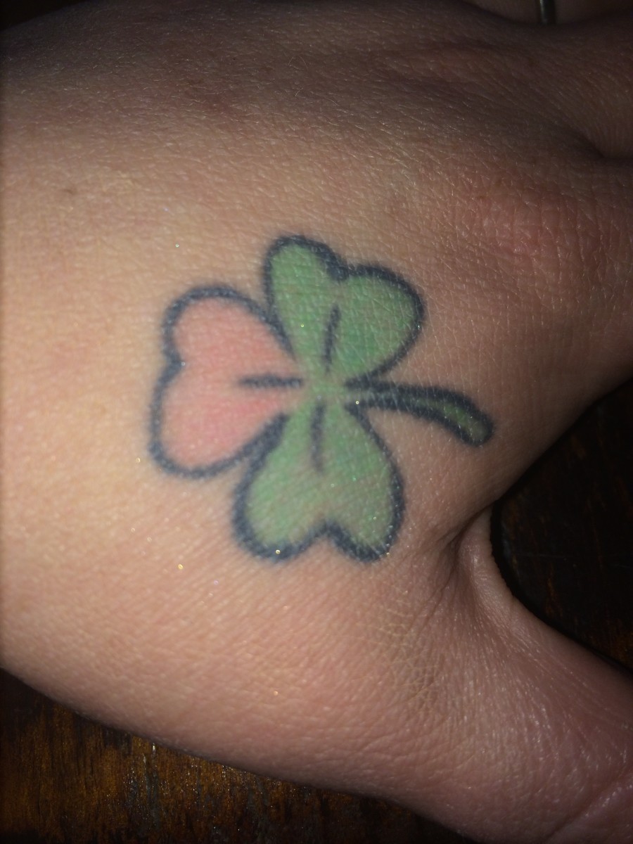 Clover tattoo on a hand