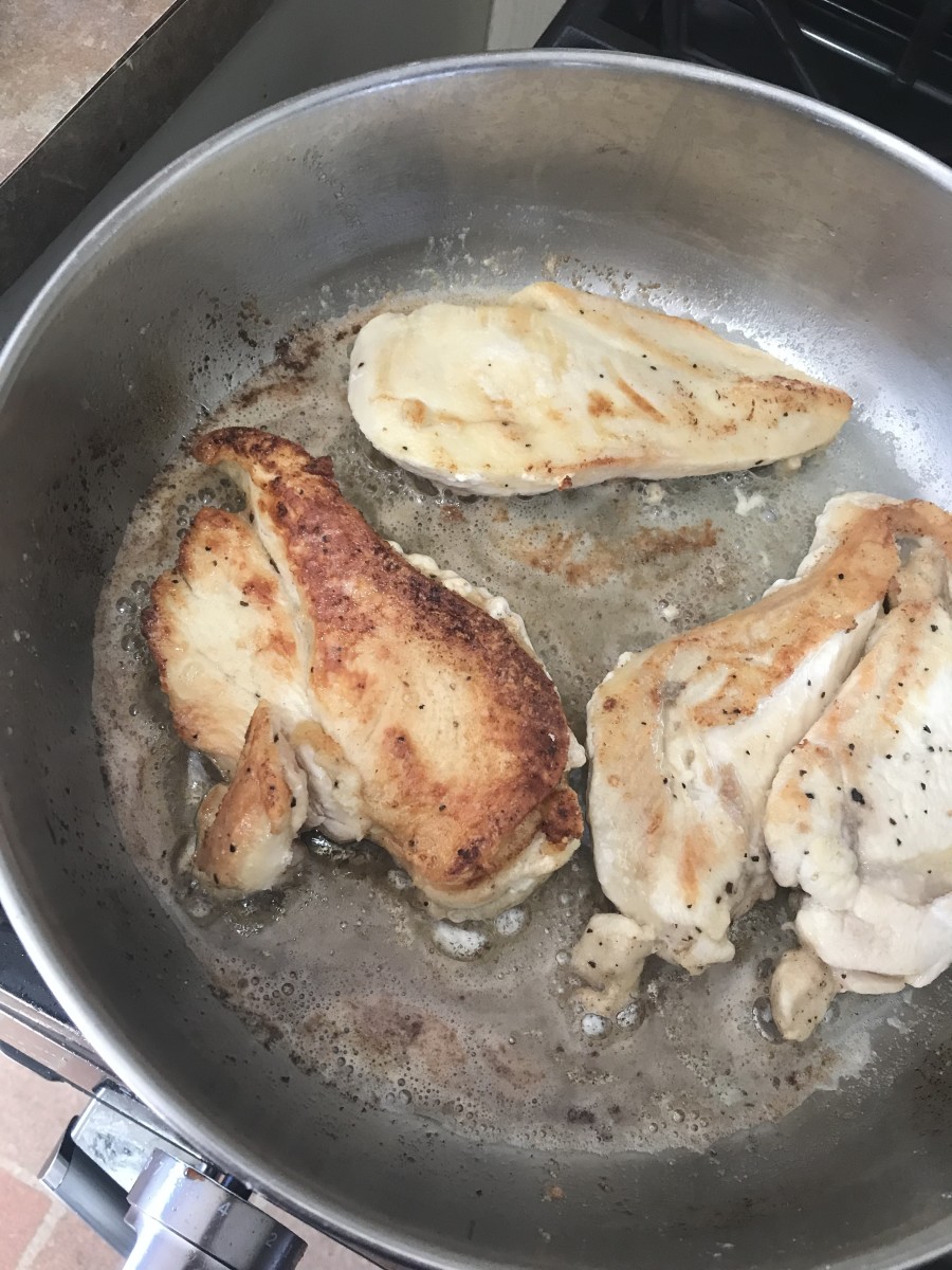 Brown the dredged chicken on both sides in both butter and olive oil. This leads to flavorful chicken and creates the foundation on which you'll build a gorgeous, flavorful pan sauce.