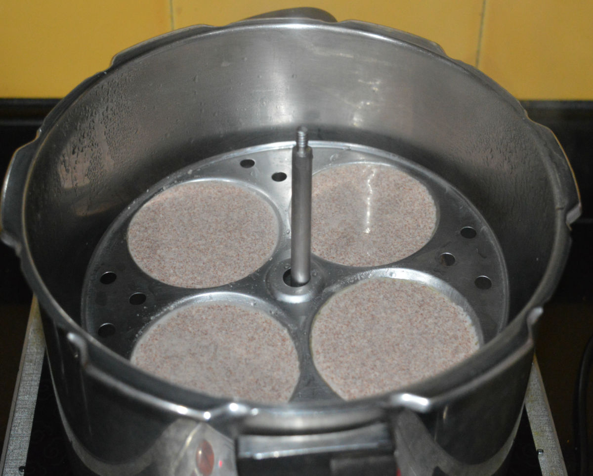 Place the stand inside the steamer or cooker. If using a pressure cooker, no need to place the weight.