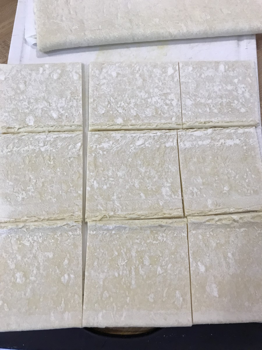 Cut each third of the puff pastry sheet into thirds, and you'll have 18 total pastries.