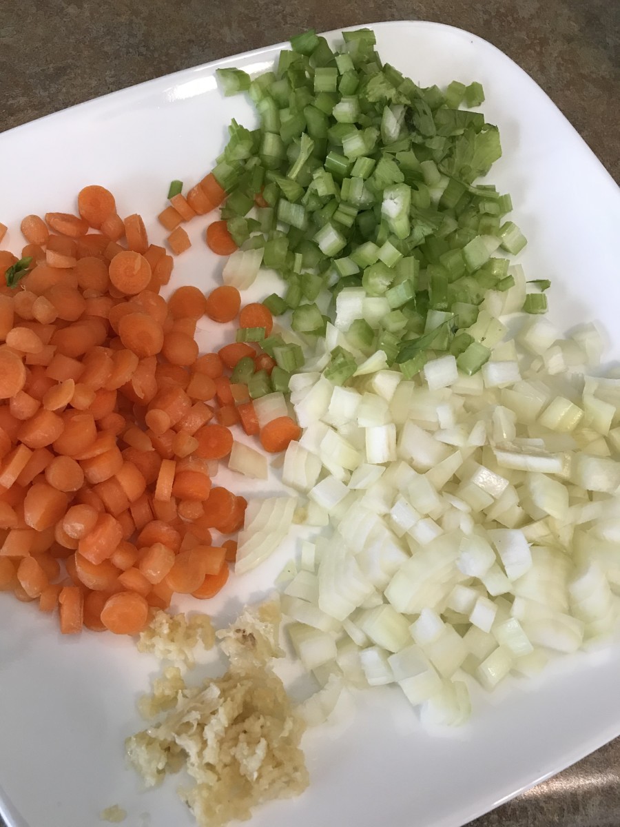 Add celery and carrots. Again, cut the veggies somewhat small. Think of the perfect spoonful of soup—if you get a little of each ingredient in the same luscious mouthful, it's perfect. So the vegetables should be cut small to fit on the spoon
