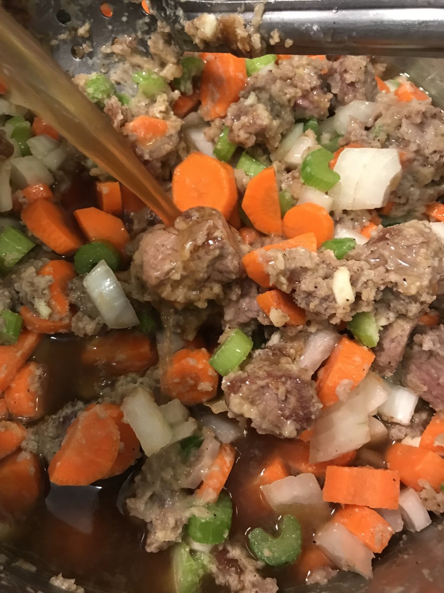 You can transfer the beef stew to a slow cooker at this point if you like. Then add the wine and beef stock. You can use red or white wine - it's to boost flavor and add a hint of acid, but not a dominate flavor by itself, so it's whatever you have.