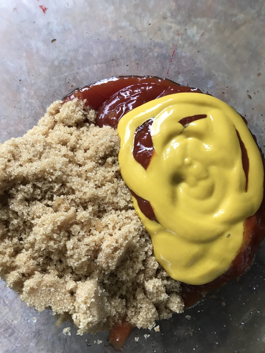Make a simple and delicious glaze for your meatloaf by mixing together equal parts ketchup, yellow mustard and brown sugar, and pouring over the meatloaves prior to baking. Bake for about 1 1/4 hours at 350F or until 160F internal temperature.