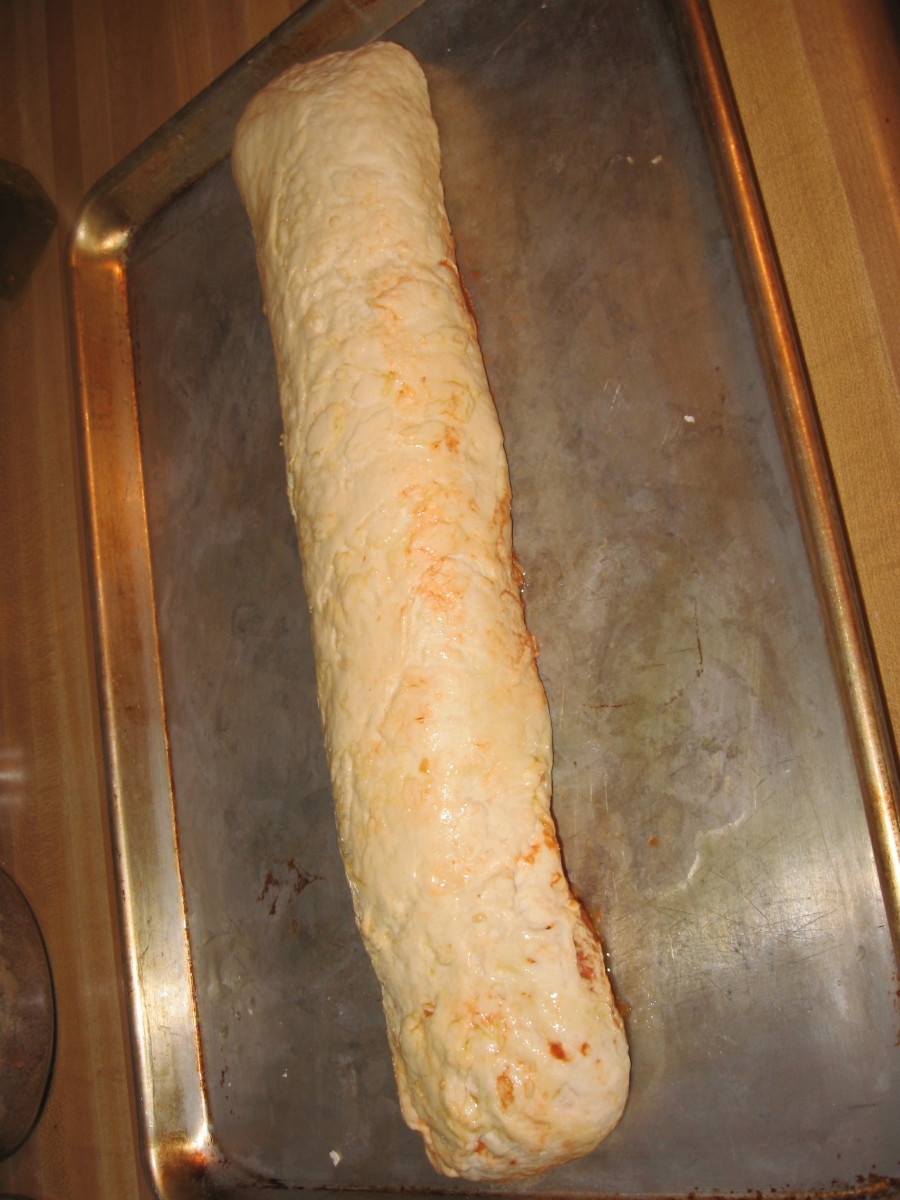 Roll tightly into a log.  Ready to go into the oven at 400 degrees for 30 minutes. 