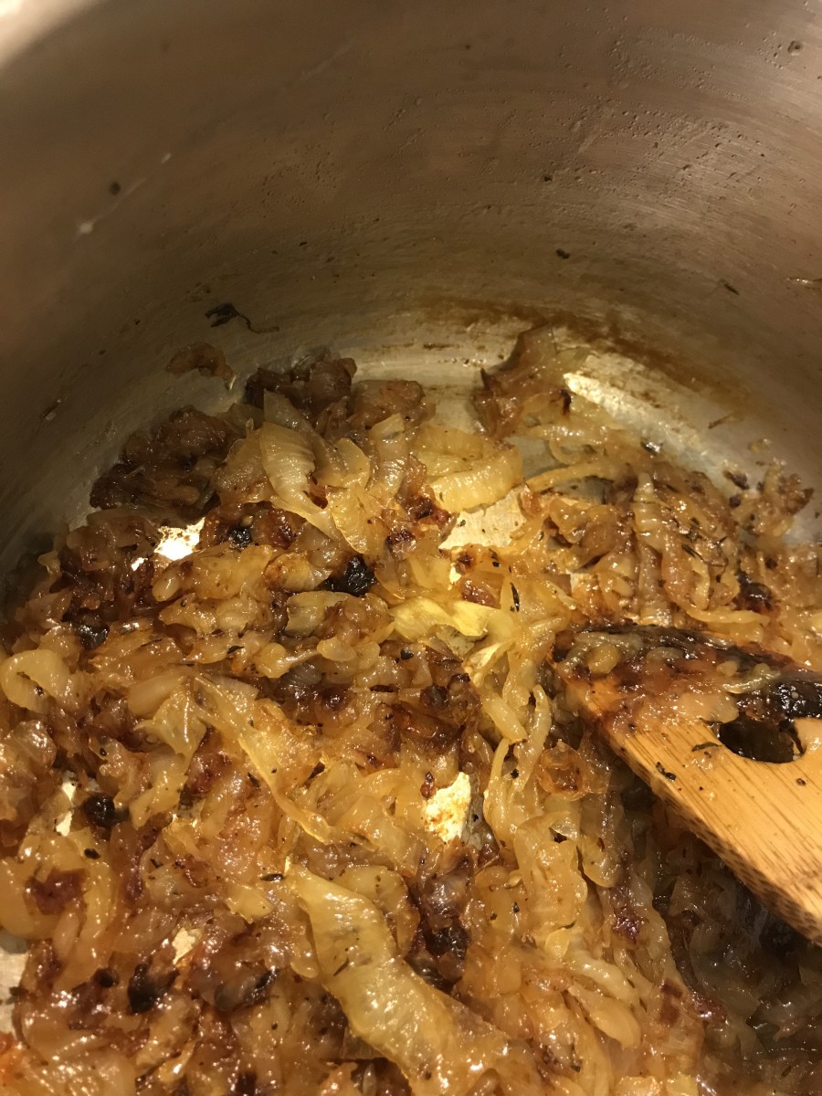 Once all the liquid has evaporated, the onions will start to brown - very unevenly. Keep stirring and scraping the bottom of the pan. Watch for the first bits of very dark brown - that's when you're getting close to done.