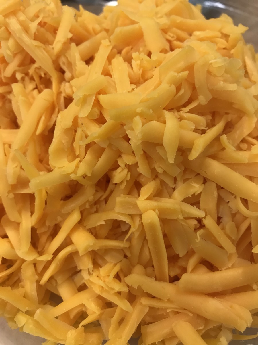 This basic recipe calls for cheddar cheese, but you can add just about anything to that. Gouda, Swiss, mild cheddar, Monterrey Jack - even blue cheese can be used to substitute for part of the cheddar. Just make sure to use a full two cups of cheese.