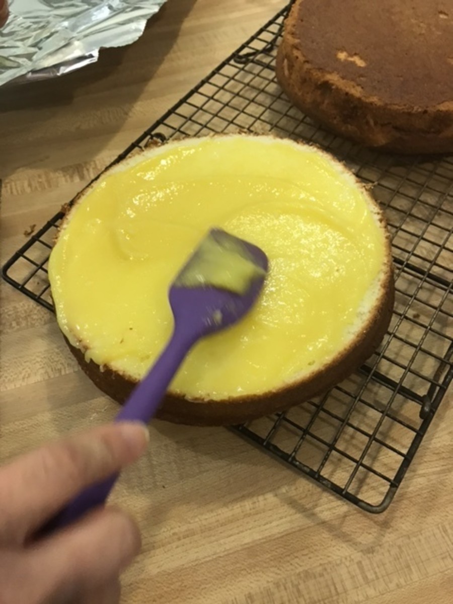 Spread the bottom half of each cake round with lemon curd - this stuff is amazing, and it makes the finished cake so super moist! I've included a video tutorial and a link to show how to make the lemon curd filling.