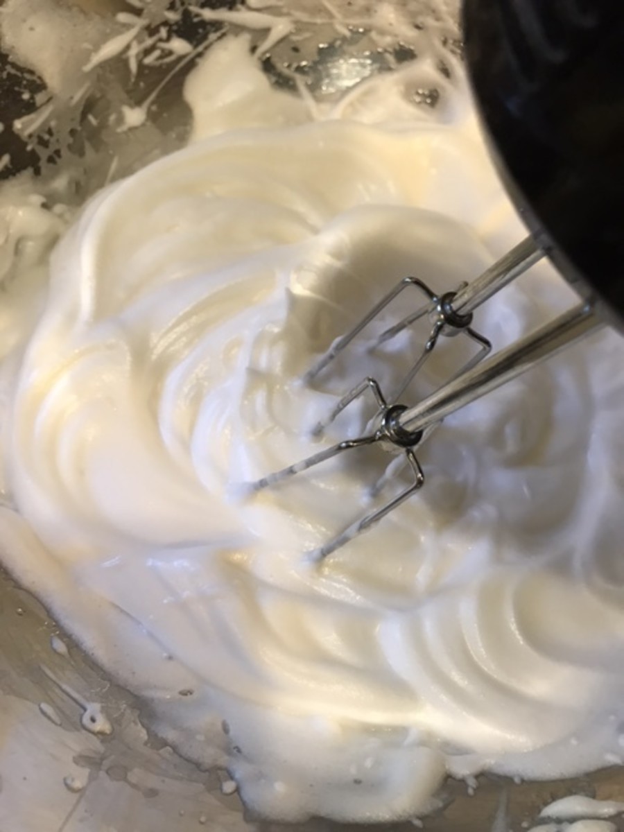 The egg whites will become thickened, glossy and will hold a peak when you lift the beaters of the mixer. This is perfect - exactly what you're looking for. This gives the cake texture and lift.