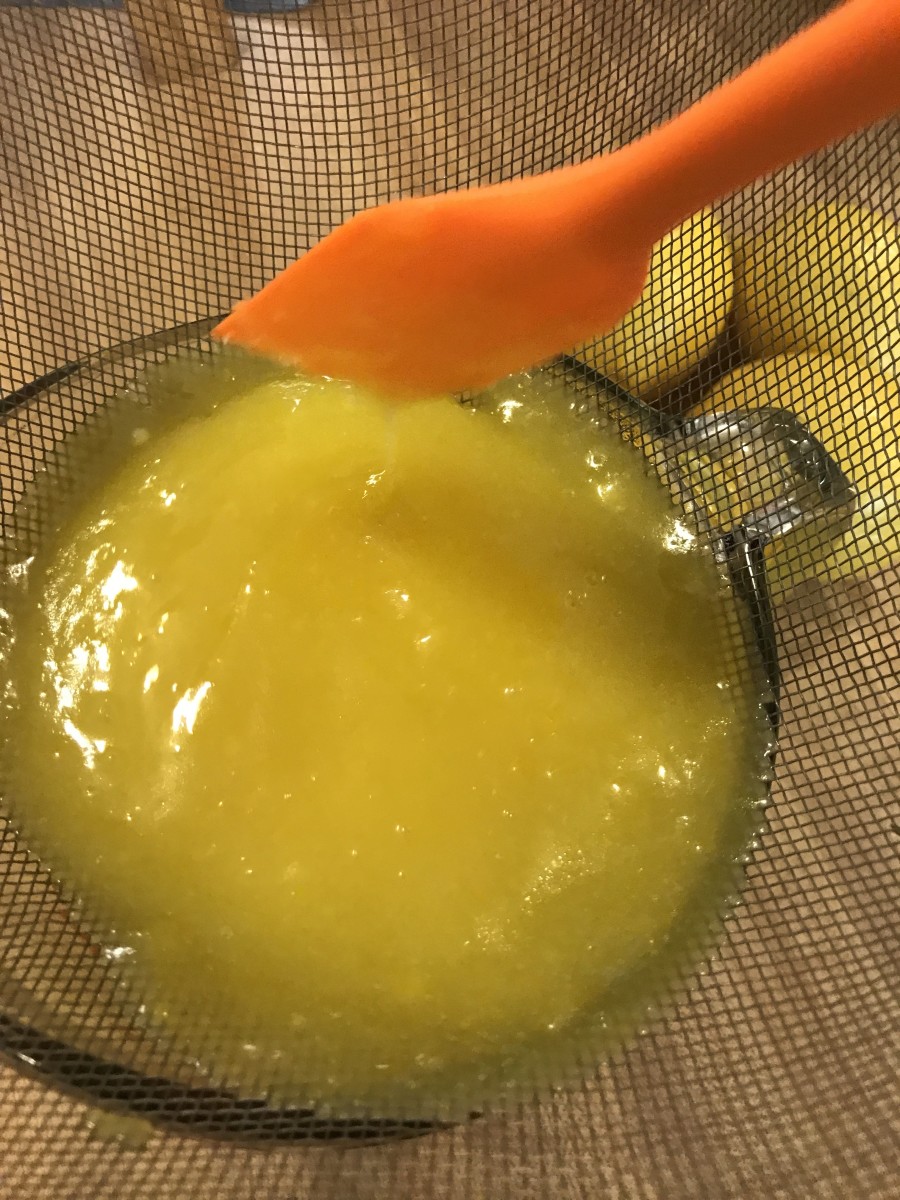 Strain the lemon curd, working it through the fine mesh of the strainer with a plastic spatula. The resulting lemon curd will be super silky!