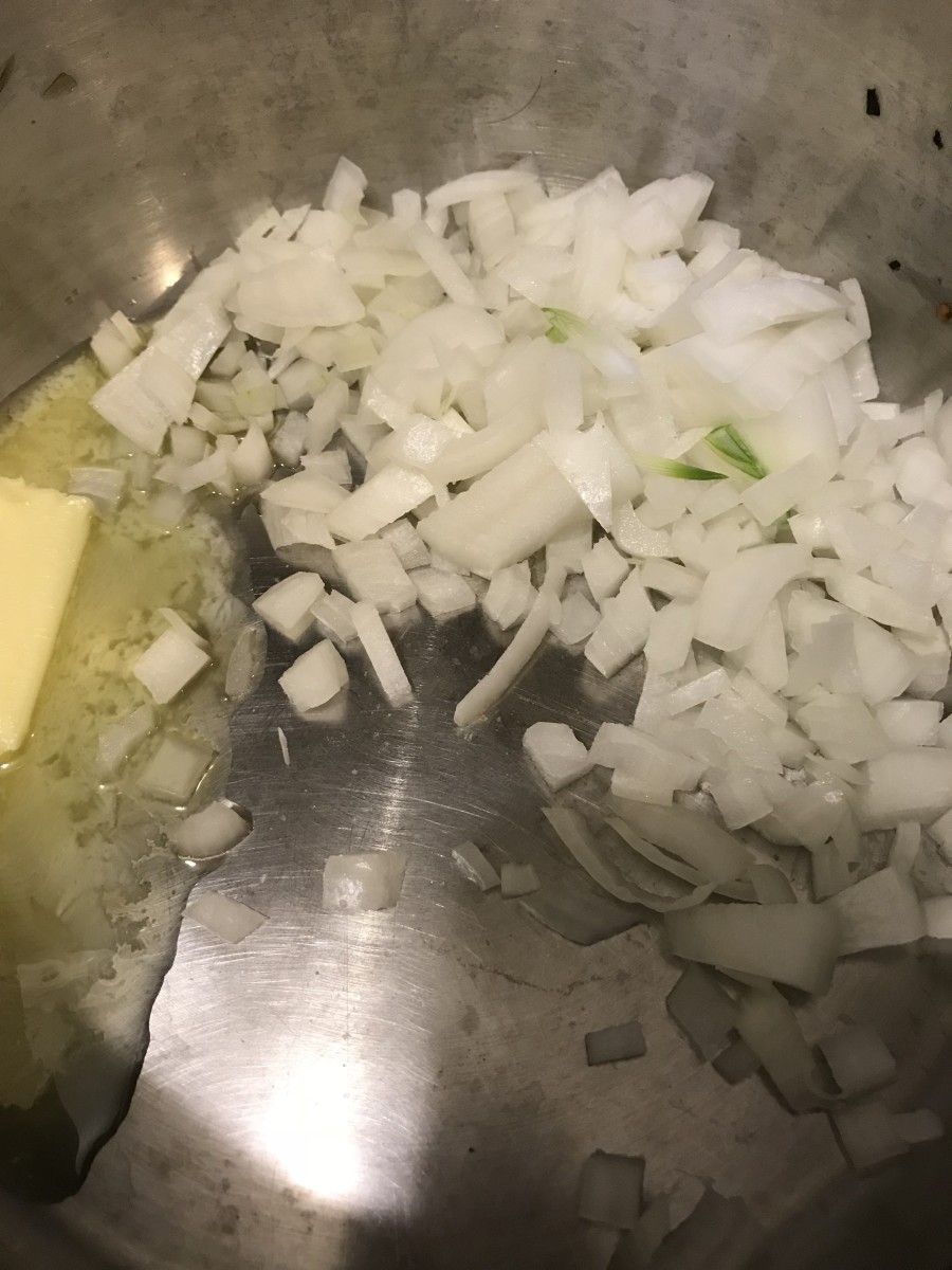Melt butter over medium low heat. Add the onion and cook just a minute or so before adding the flour. This forms the flavor base for the soup.