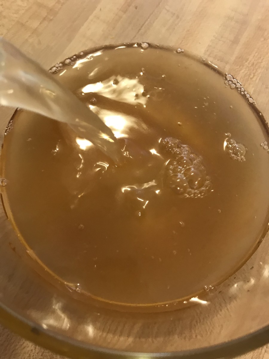 Stir together 2 cups of chicken broth, two tablespoons apple cider vinegar and two tablespoons honey in a glass dish. You'll use this to baste the turkey.