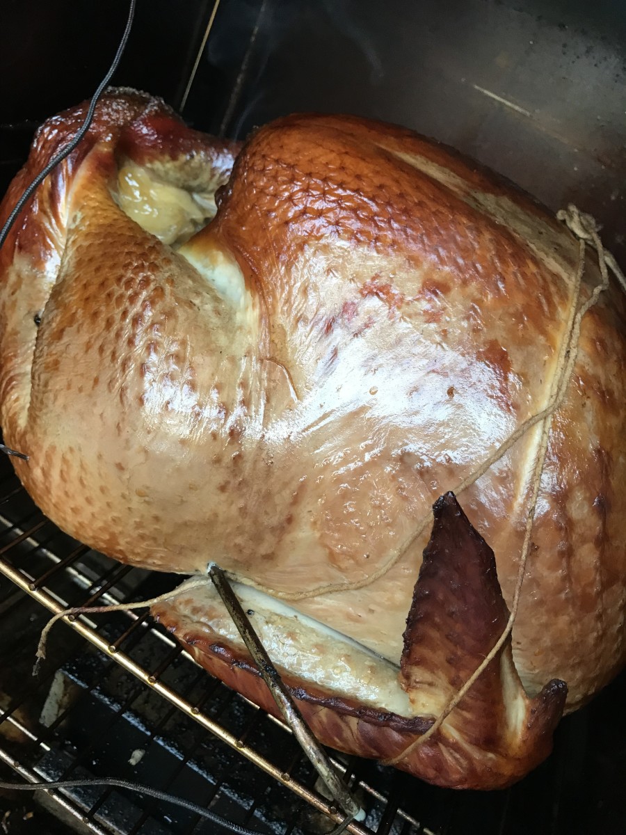 Other than adding chips, leave the bird alone. Don't open the smoker more than necessary - it lets all the heat and smoke out. This bird was big - about 24 pounds and took a good 12 hours to reach 165F.
