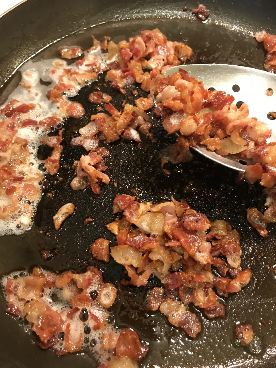 Cook the bacon until crisp, then remove it and set it aside. Drain off all but a teaspoon or so of the bacon grease, and return the pan to medium heat.
