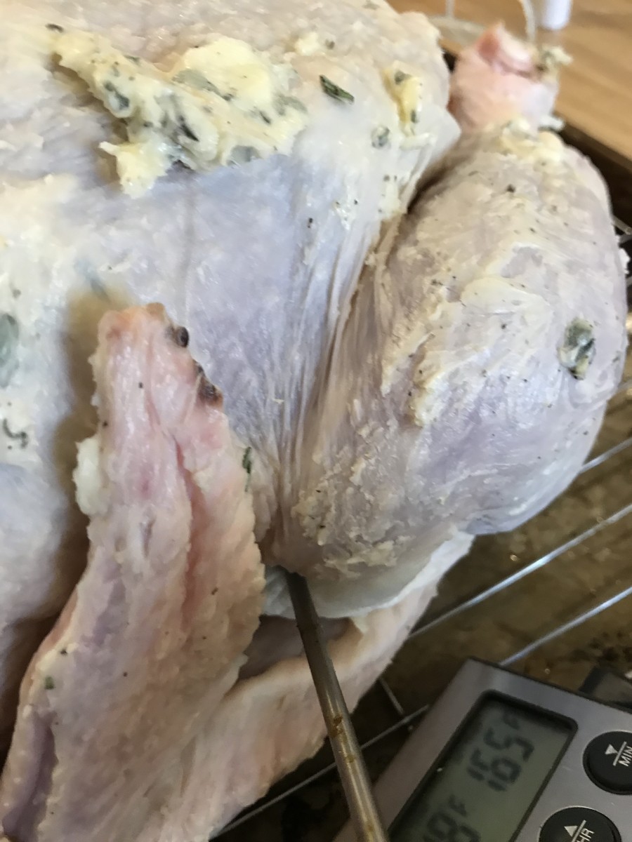 Place the thermometer into the thickest part of the thigh, behind the leg. Set the temperature for 165F. This ensures the thigh will be perfectly cooked without over cooking the breast.