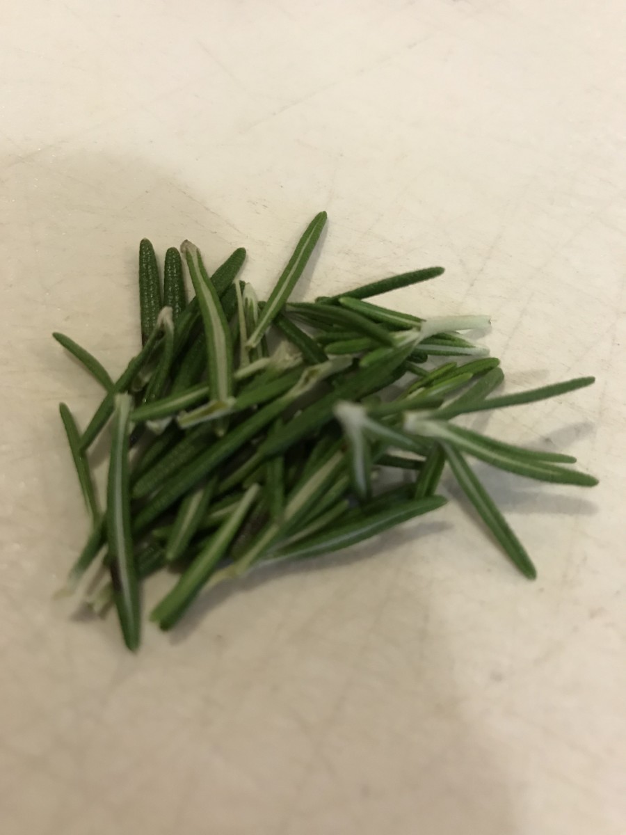 I love fresh rosemary; the flavor is like nothing else. Make sure you mince it very finely, since this herb is rather tough. You want the tiniest possible pieces in the finished herb butter.