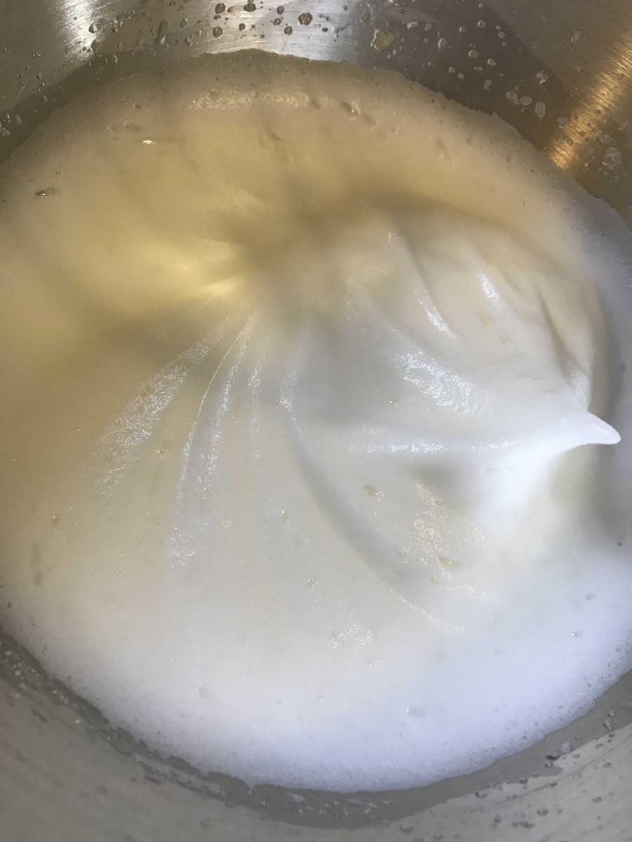 Just keep whisking the whites until soft peaks form - this just means that if you lift the whisk, the whites will hold the shape - just like in the picture.