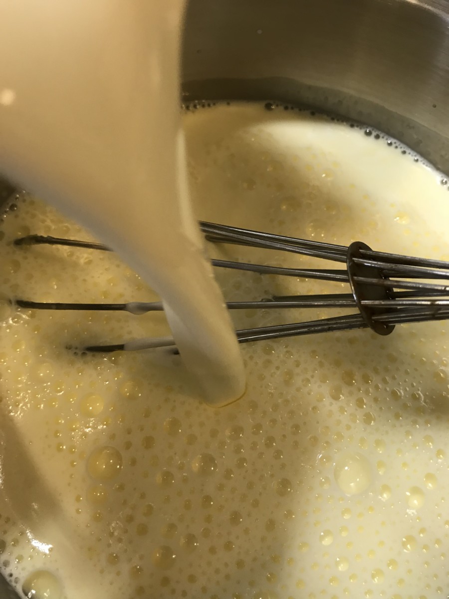 Whisk in the cream, whisking well. Just keep whisking - you'll make sure that the eggs cook through without curdling. Watch the temperature carefully - you're looking for 170F. Don't let the mixture come to a boil or a simmer - it will curdle.