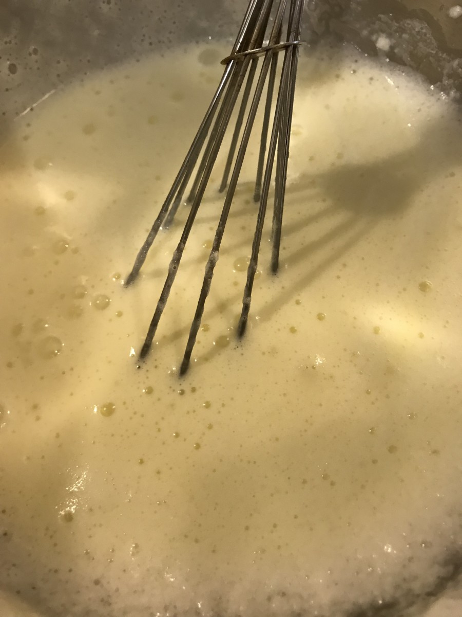 Once the custard base has completely chilled, whisk together the whites and milk/cream mixture. You can store it in the fridge at this point, simply whisk it well again before serving. 