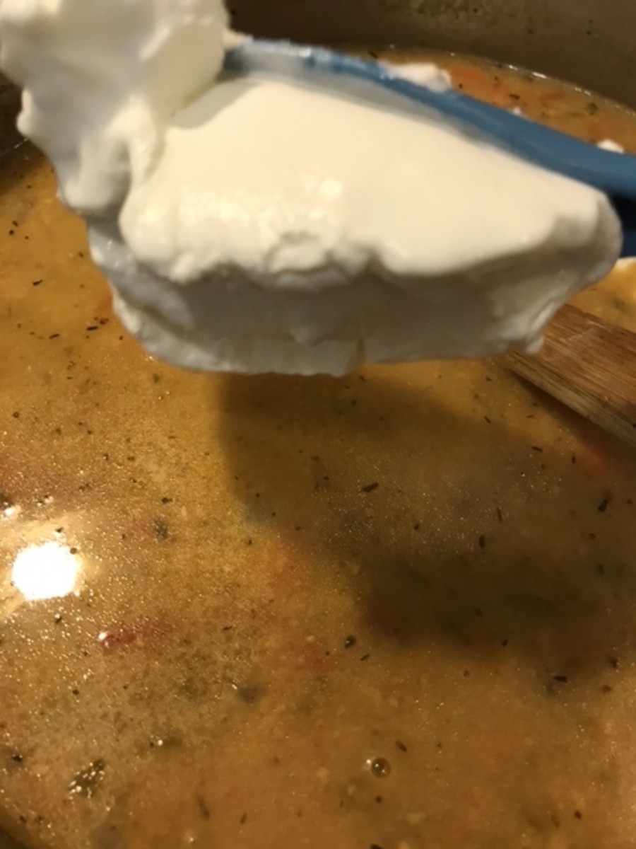 Stir in the sour cream and mix it well to fully incorporate. The sour cream will only take a moment to melt into the soup. Keep the heat low now - don't boil it after adding the sour cream or it could break and curdle.