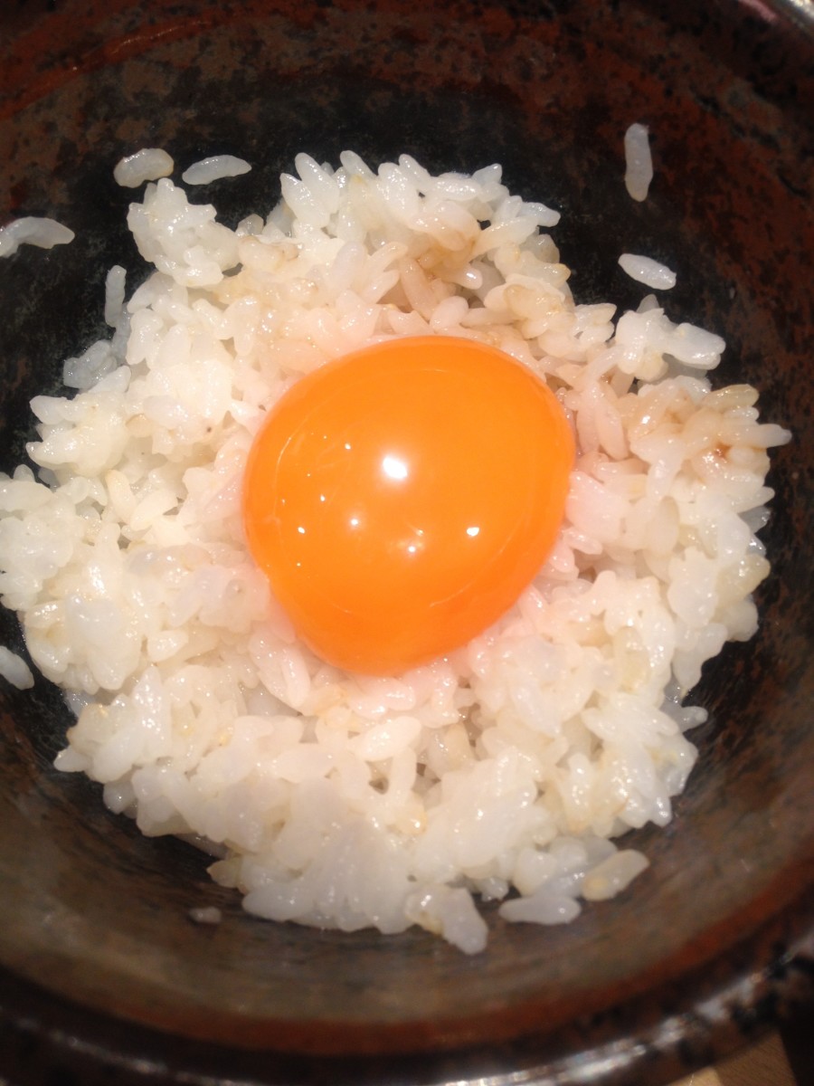 Raw egg on white rice; delicious!