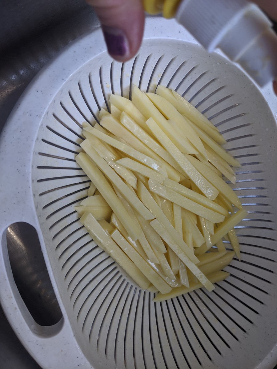Coat the fries with olive oil.