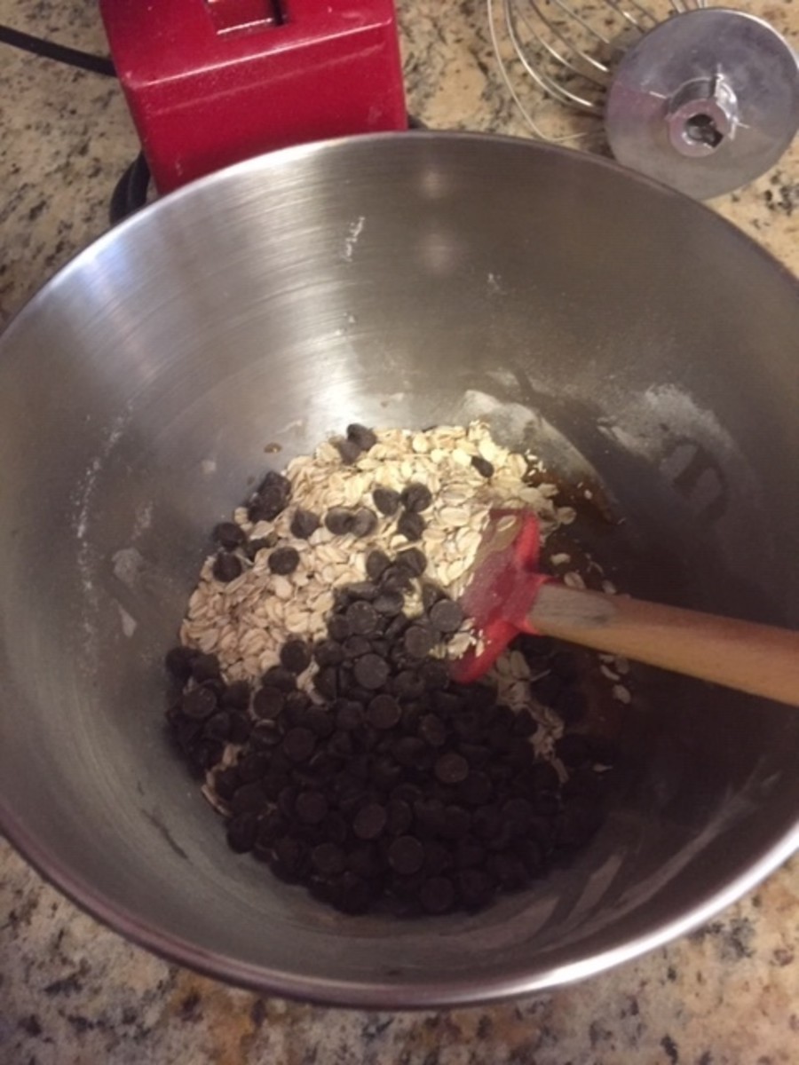 Stir in the oats and chocolate chips with a wooden spoon.