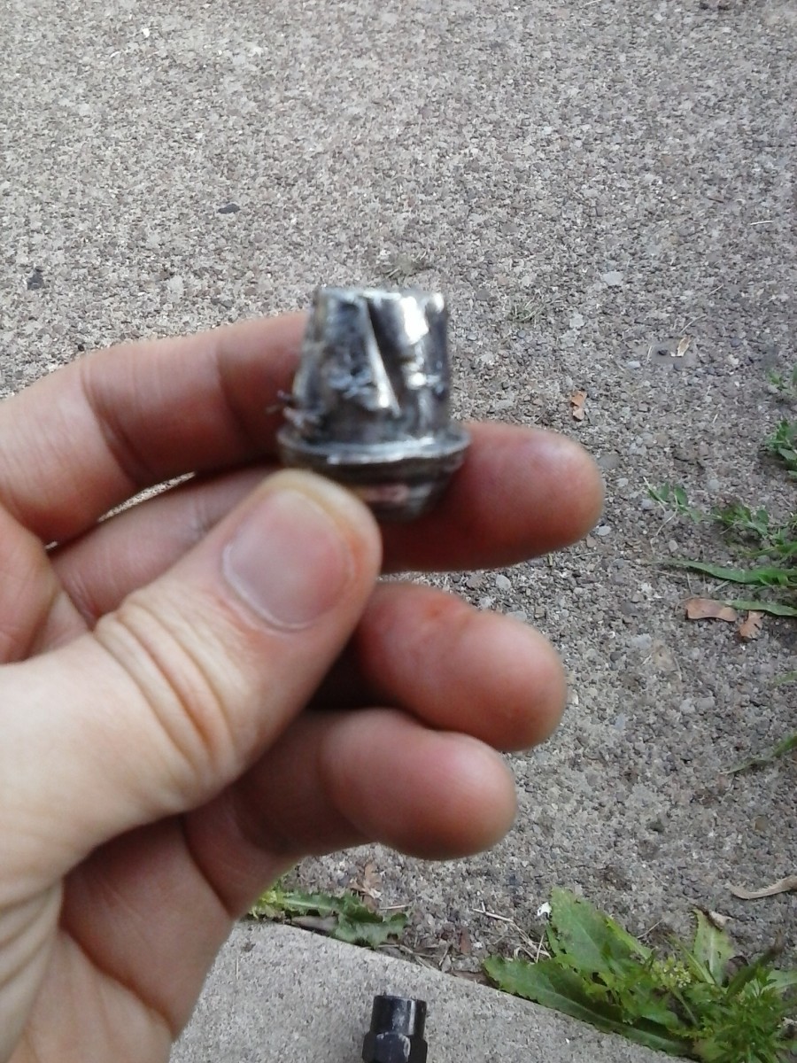 Close up view of what the lug nut looks like afterwards. Note the grooves made by the twist socket.
