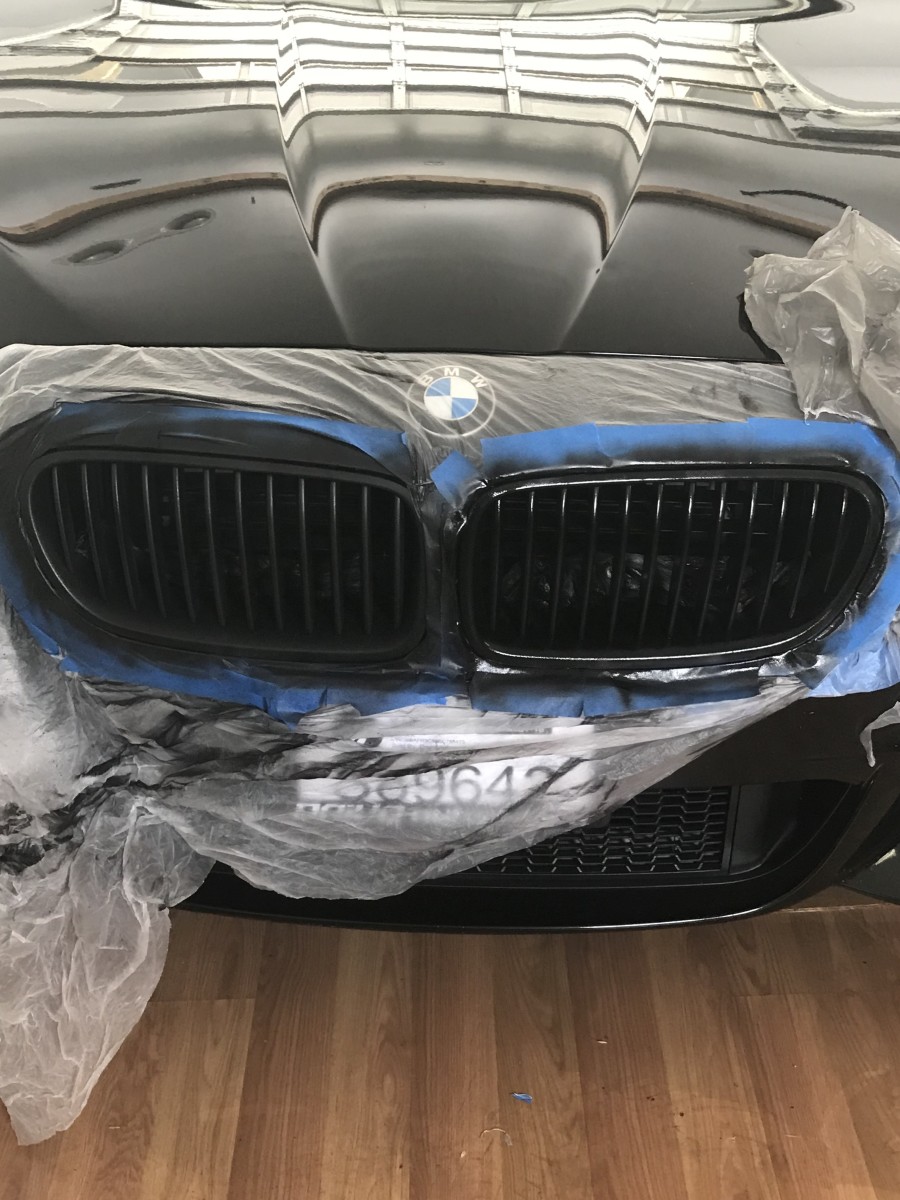 You may find it easier to remove the grill to apply Plastidip. In this case, it was more of a hassle. So, I used plastic around (and inside of) the grill.