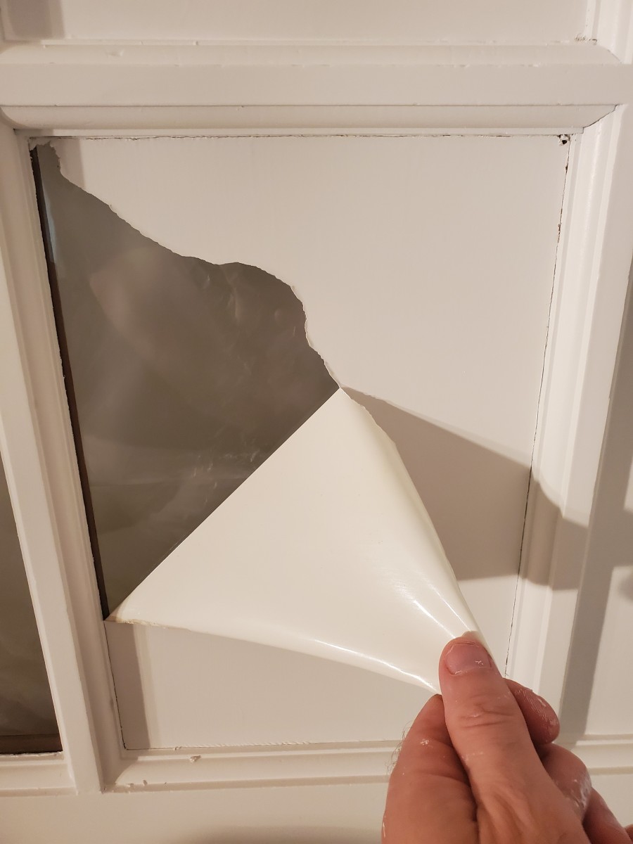 The masking liquid peels off the glass when you're ready to remove it.