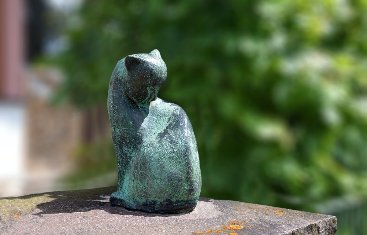 A garden statue shaped like your friend's pet is a thoughtful and beautiful gift idea.