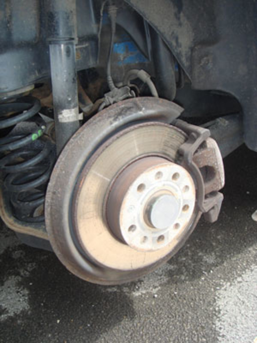 Access the brake unit by removing the wheel.