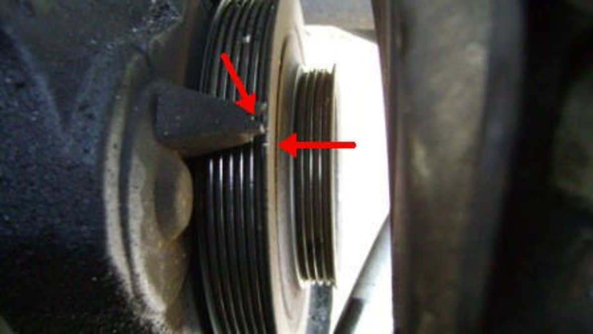 Crankshaft pulley top-dead-center (TDC) mark.