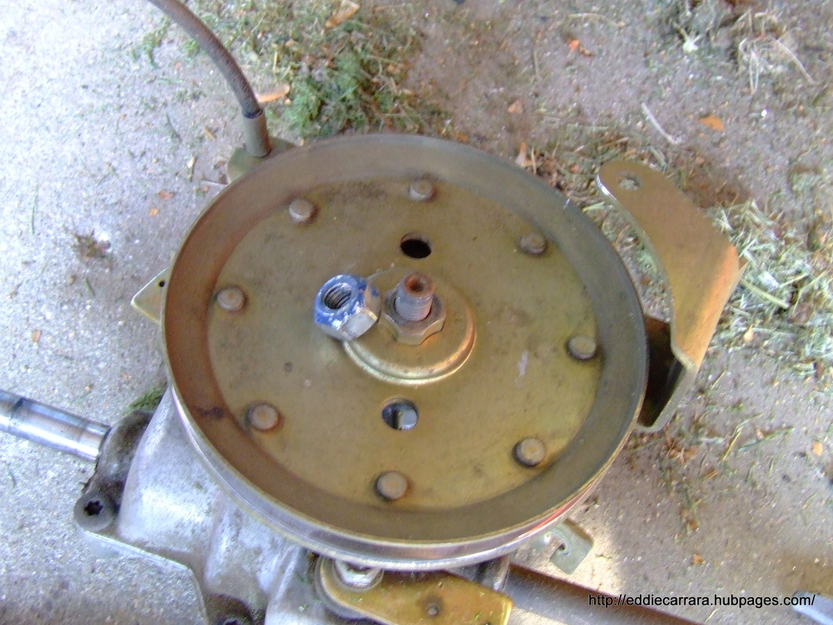 Remove the pulley from the transmission on the Honda Harmony 215