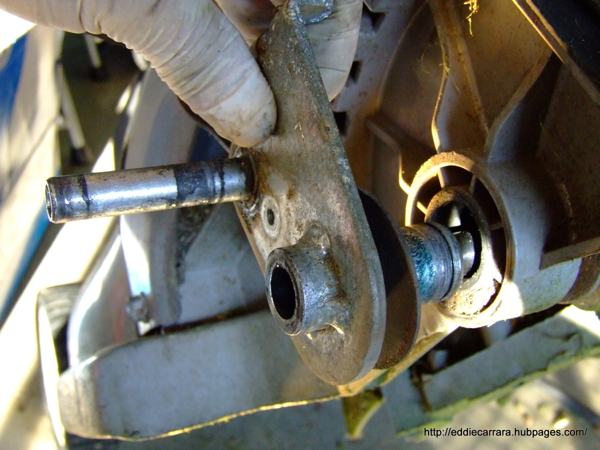 Remove the wheel height adjusters on the Honda Harmony 215.