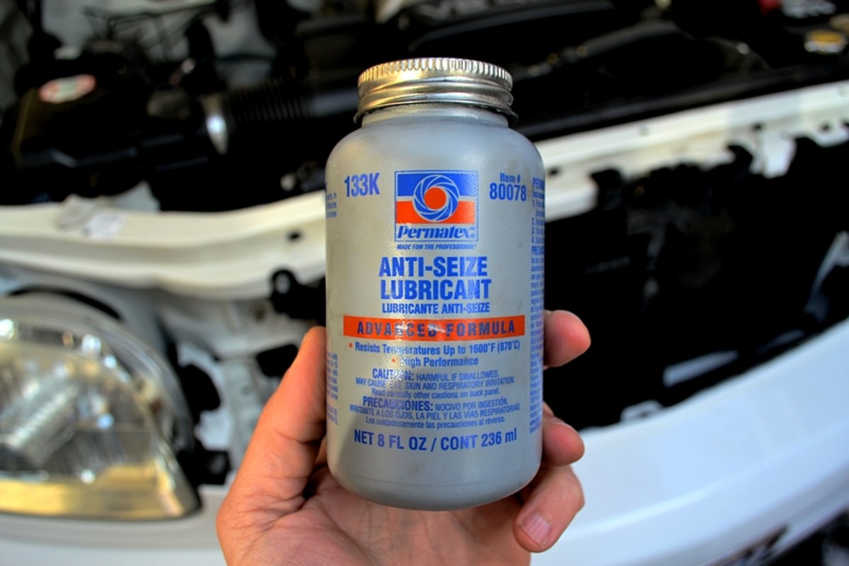 A bottle of anti-seize lubricant.  Adding this to the spark plug threads will ensure your plugs can be easily removed the next time you change plugs and you don't strip your engine block threads.