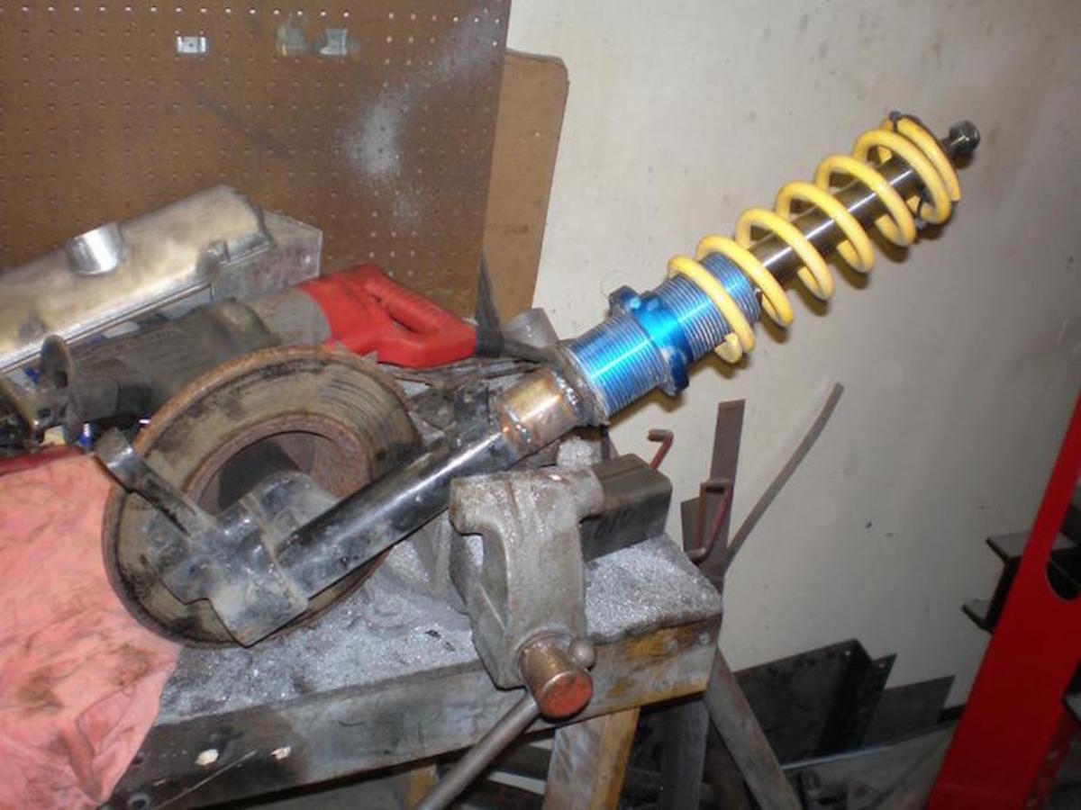 A strut assembly with coil, mounting base and cartridge.