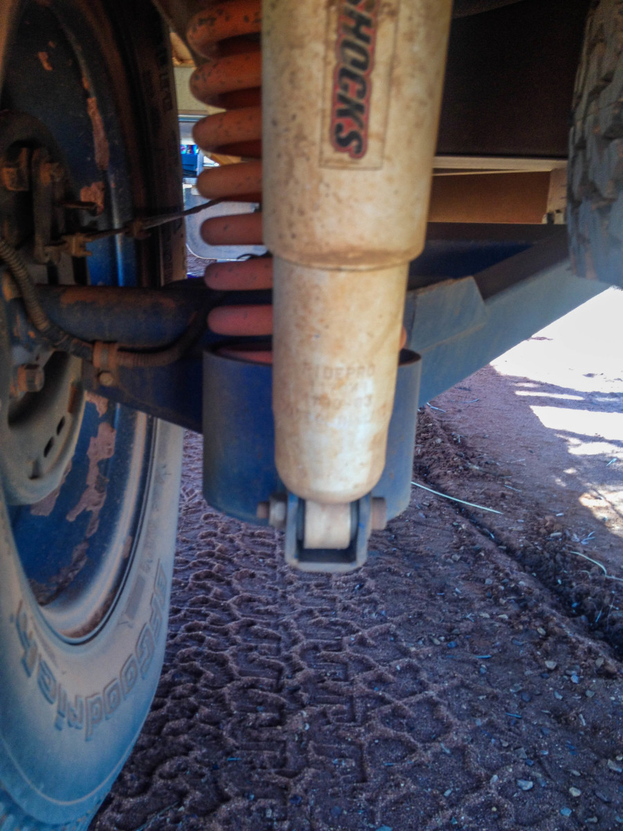 You can find a shock absorber behind the wheel assembly.
