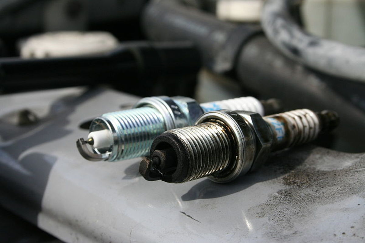 Carbonized spark plugs can lead to engine overheating and dieseling.